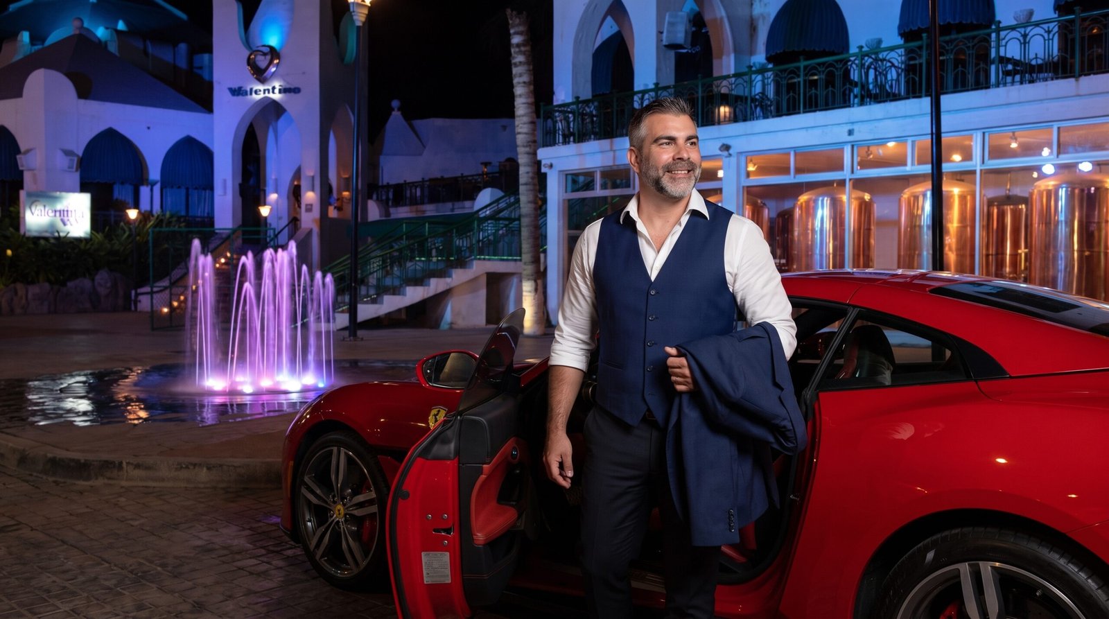 Man_smiling_with_sports_car_202607101618